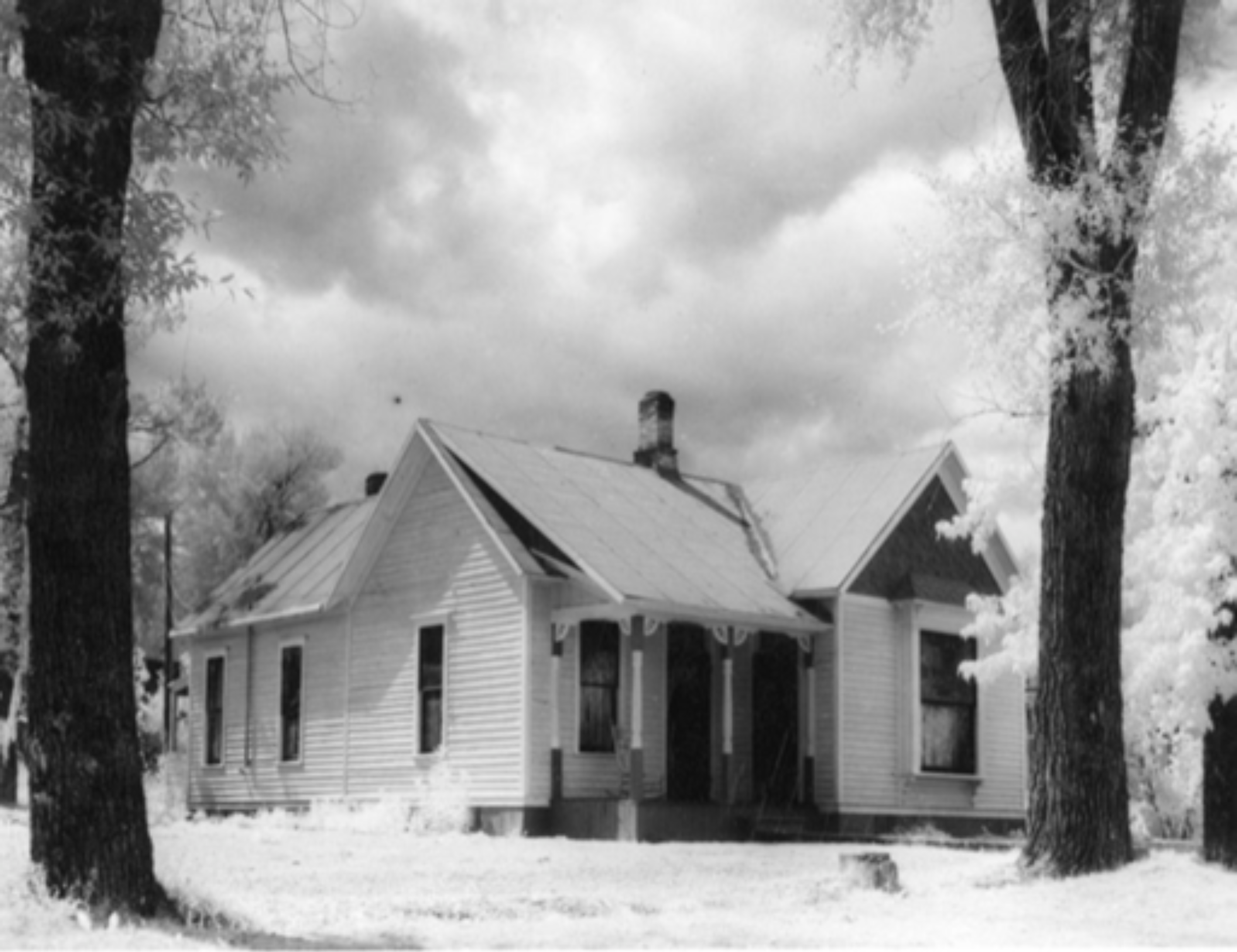 An old black and white photo of the exterior of the Smugglers Residence.